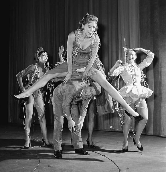 Comedian Norman Wisdom with cast members of his pantomime The Wonderful Lamp 1956