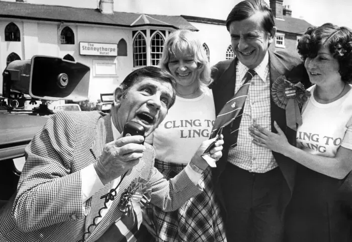 Framed Print : Comedian Norman Wisdom repays a favour by canvassing for Midlands Central Tory candidate