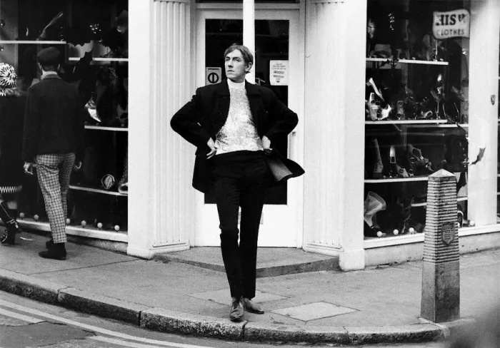 Framed Print : Comedian Peter Cook stands in Carnaby Steet during the filming of sketch for