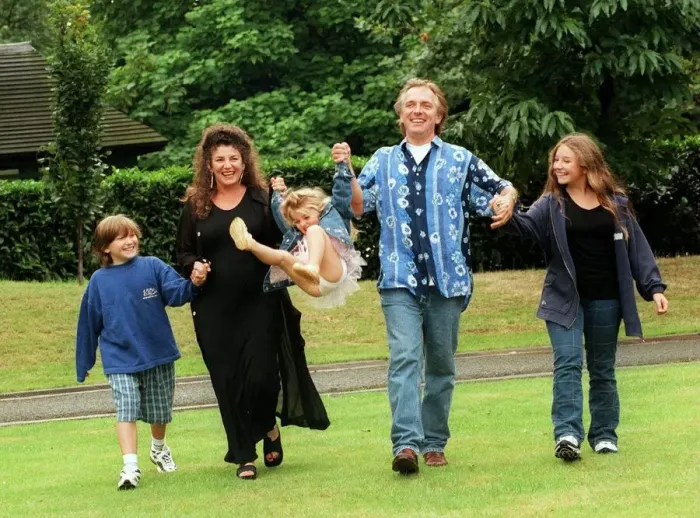 Framed Print : Comedian Rik Mayall with his family, wife Barbara and three children, Rosie