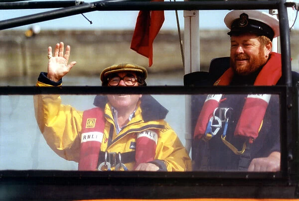Comedian Ronnie Corbett on the Seahouses RNLI lifeboat with coxswain David Shiell