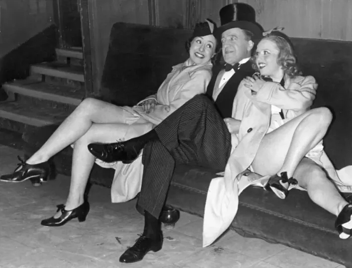 Framed Print : Comedian Tommy Handley with two modern girl secretaries at Jack Hylton Framed Print : Comedian Tommy Handley with two modern girl secretaries at Jack Hylton