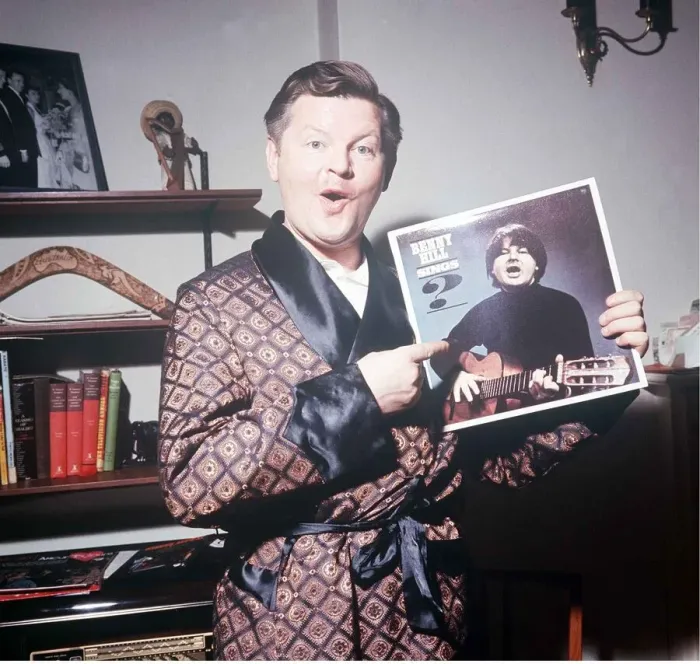 Framed Print : Comedy actor Benny Hill in his Kensington flat February 1966 holding a record Framed Print : Comedy actor Benny Hill in his Kensington flat February 1966 holding a record
