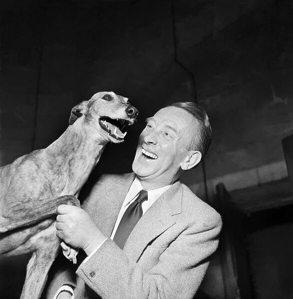 Comic actor Wilfred Pickles with 'Lassie'the greyhound. March 1952 C1229