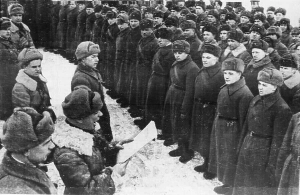 The Comissar of a Russian Military unit reading the Order of the Day issued by leader