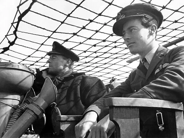 A Commander and Pilot Officer on bridge of a destroyer. The RAF is sending their crews