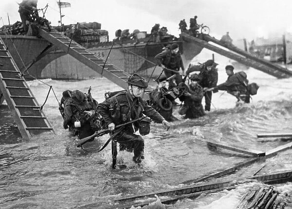 Commandos of the 4th Special Service Brigade coming ashore from landing craft on Nan Red