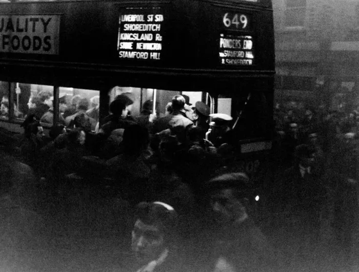 Framed Print : Commuters swarm on to a number 649 bus in Tottenham on a gloomy winters evening Framed Print : Commuters swarm on to a number 649 bus in Tottenham on a gloomy winters evening