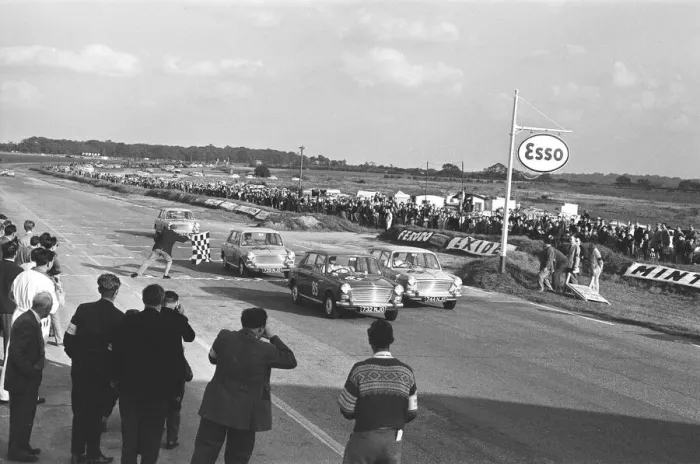 Framed Print : Competitors take the checkered flag in the Molyslip Morris 1100 race at Snetterton race Framed Print : Competitors take the checkered flag in the Molyslip Morris 1100 race at Snetterton race