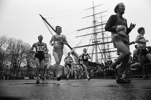Competitors in the London marathon round the Cutty Sark Ship. 29th March 1981