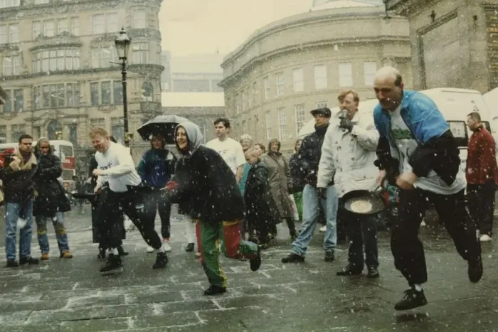 Framed Print : Competitors strugging through snow and sleet to take part in the Shrove Tuesday Pancake Framed Print : Competitors strugging through snow and sleet to take part in the Shrove Tuesday Pancake