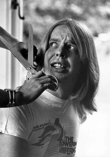 Composer Rick Wakeman having his hair cut. P007273