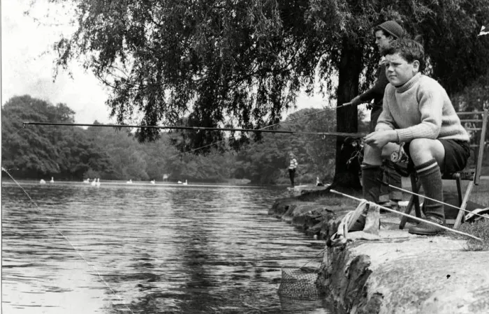 Framed Print : Concentration and determination reflected on the faces of these young fishermen enjoying