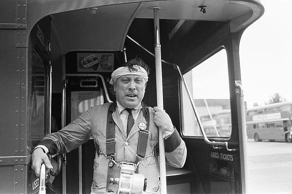 A conductor at the Hanwell bus garage of London transport wearing a mock turban to