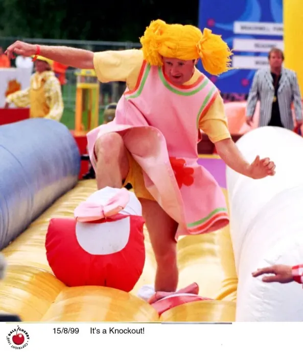 Framed Print : Contestants in the TV Programme Its A Knockout Aug 1999 wearing funny costumes playing Framed Print : Contestants in the TV Programme Its A Knockout Aug 1999 wearing funny costumes playing