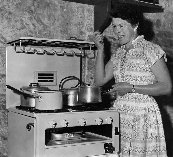 Cooking a celebration meal on a troublesome oil stove on her 38th birthday, Mrs