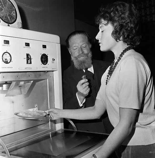 Cooking by microwaves. Circa 1962