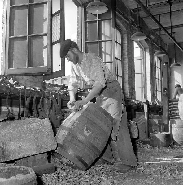 Coopers making beer barrels at the Whitbread brewery. October 1958