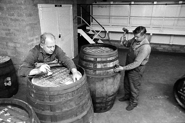 Coopers prepare Sherry casks before they are filled with Whisky at the Knockando Whisky