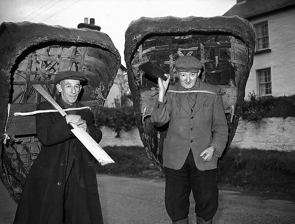 Coracle Fisherman with their craft on their backs- 1952