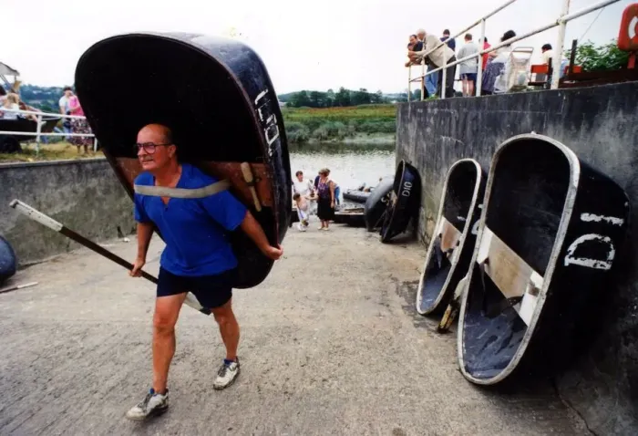 Framed Print : Coracle racing - The tradition of coracle racing returned to the Tywi at the weekend - as