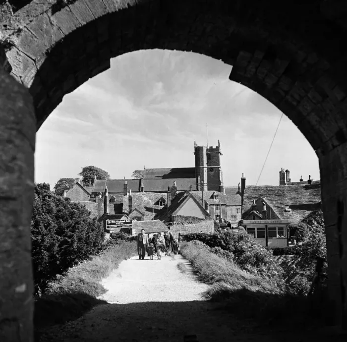 Framed Print : Corfe Castle village, Dorset. Circa 1952 Framed Print : Corfe Castle village, Dorset. Circa 1952