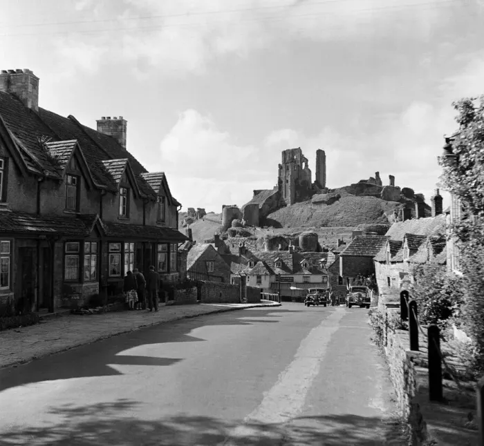 Framed Print : Corfe Castle village, Dorset. Circa 1952 Framed Print : Corfe Castle village, Dorset. Circa 1952