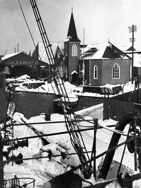 A corner of the Cardiff docks showing the Norwegian church covered in snow after a heavy
