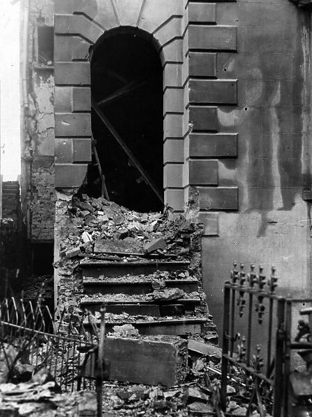 Corner of a house damaged by a bomb dropped in a South Wales town. Circa 1941