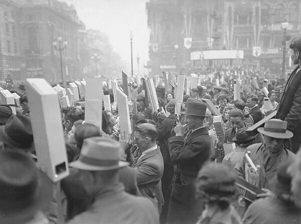 Coronation of King George VI. Huge crowds of people with their periscopes to get a