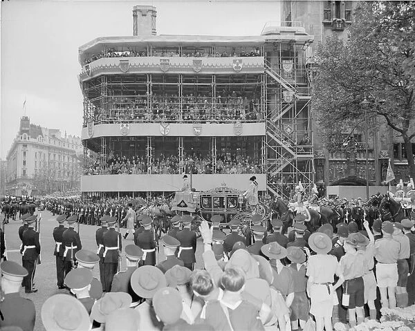 The Coronation of Queen Elizabeth II. Crowds cheers as the coach containing