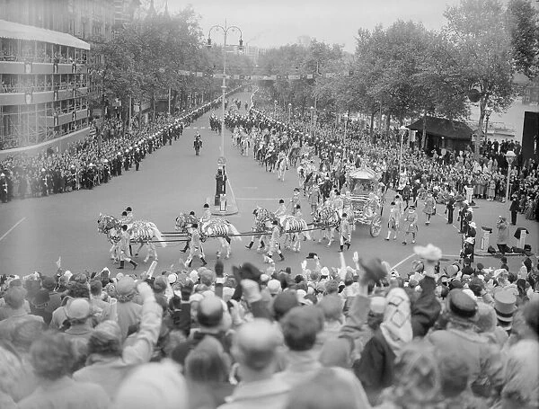 The Coronation of Queen Elizabeth II. Horses pull the carriages as the procession