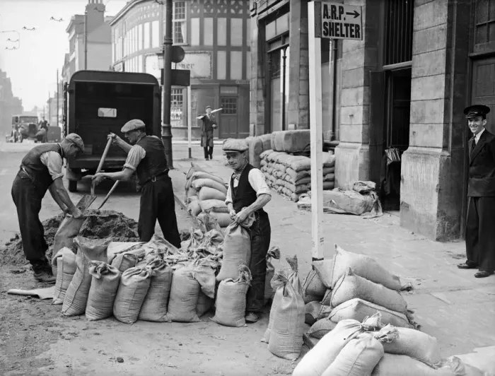 Framed Print : Corporation workmen filling and place sandbags to protect civic building from bomb blast Framed Print : Corporation workmen filling and place sandbags to protect civic building from bomb blast