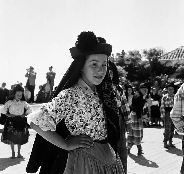 Costumed local children in Nazare, Portugal. 9th June 1959