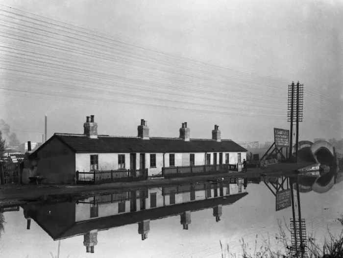 Framed Print : Cottages reflected in the Grand Union Canal near Uxbridge Circa 1934 Framed Print : Cottages reflected in the Grand Union Canal near Uxbridge Circa 1934