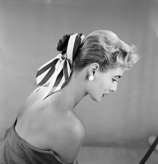 Framed Print : Cotton scarf and flower decorations for the hair, modelled by Pat O Reilly. July 1955 Framed Print : Cotton scarf and flower decorations for the hair, modelled by Pat O Reilly. July 1955