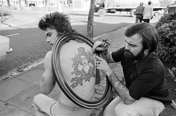 Council gardener Ian Hewison is so proud of the Chinese girl tattooed on his back he