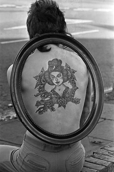 Council gardener Ian Hewison is so proud of the Chinese girl tattooed on his back he