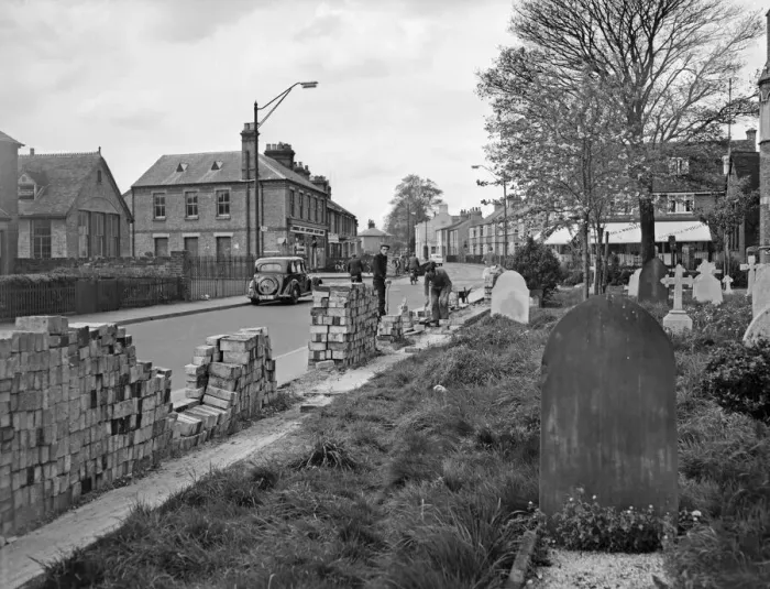 Framed Print : Council workman building a new wall during the alterations to Victoria Road, Cambridge