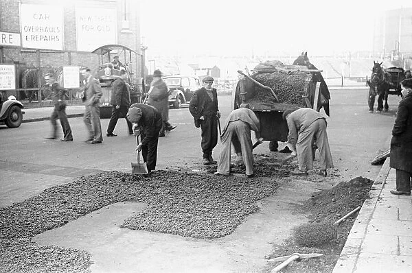 Council workmen seen here repairing a road in Kingston Upon Thames January 1939