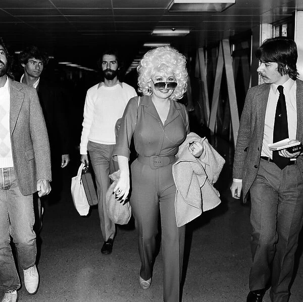Country & Western singer Dolly Parton arrving at London Airport. 22nd March 1983