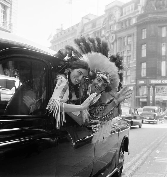 Couple of actors dressed as an Indian Chief and his Squaw
