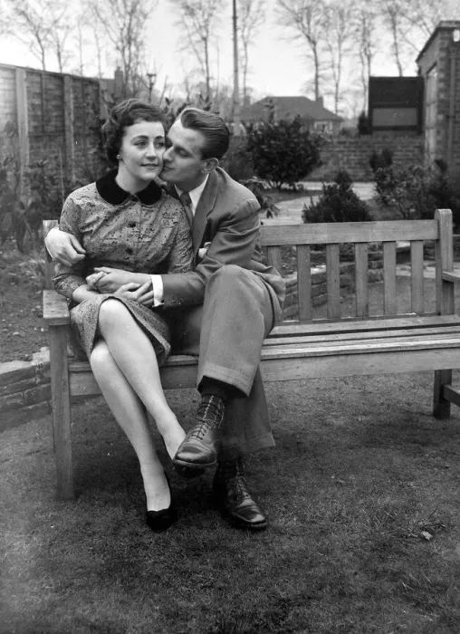 Framed Print : Couple Catherine Egan and Francis Byrne cuddling on a wooden bench in Liverpool Framed Print : Couple Catherine Egan and Francis Byrne cuddling on a wooden bench in Liverpool