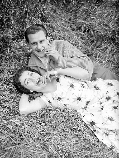 Couple Catherine Egan and Francis Byrne enjoy a relaxing break in a haystack March