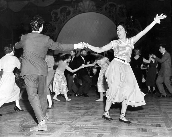 A couple enjoying rock n roll dancing - Jiving at Nottingham Palais