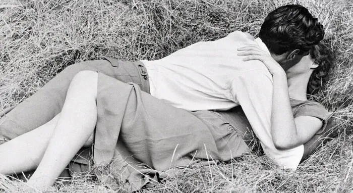 Framed Print : This couple in love found the perfect spot in the hay for their kiss