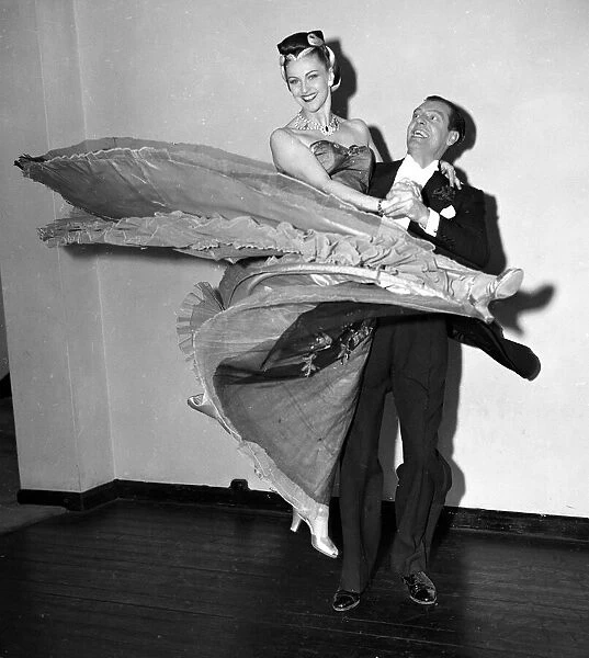 Couple performing a ballroom dance circa 1952
