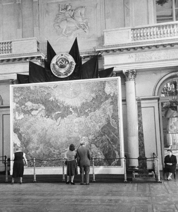 Framed Print : A couple of tourist look at a map of the Soviet empire on display in the Hermitage Framed Print : A couple of tourist look at a map of the Soviet empire on display in the Hermitage
