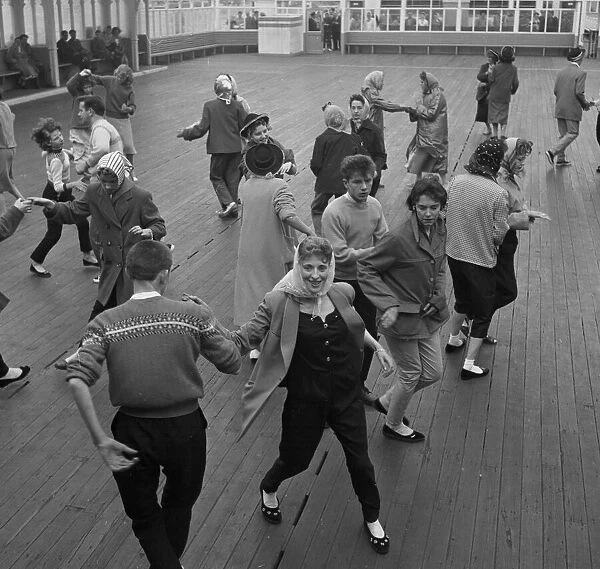 Couples rock and roll dancing on the central pier during Blackpool week August 1958