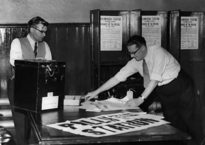 Framed Print : Courtroom into polling station - Mr V. N. Bowen (left) and Mr H Framed Print : Courtroom into polling station - Mr V. N. Bowen (left) and Mr H